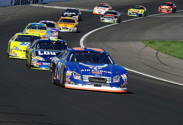 Branded Nascars racing round an American Oval Track.